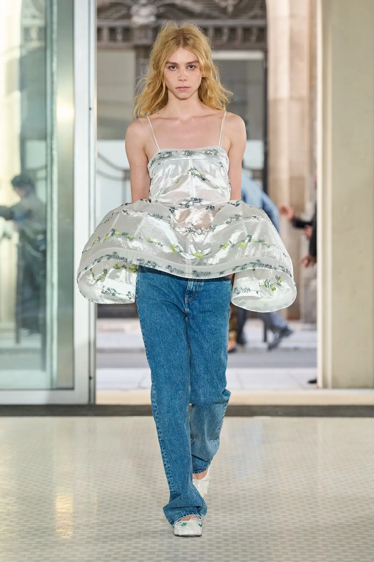 Cecilie Bahnsen, Look 20. A sheer embroidered peplum over jeans.