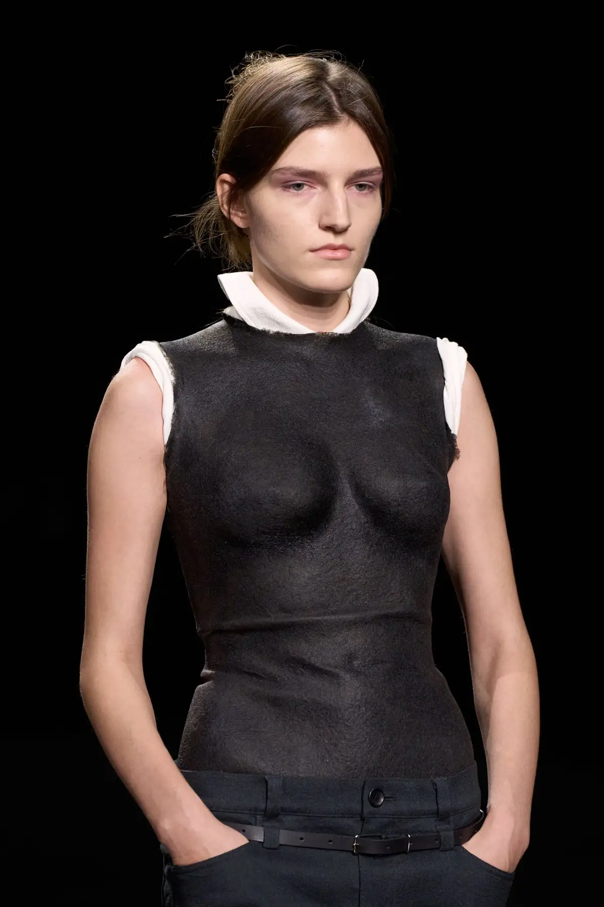 Detail. A black moulded bodice, up close.