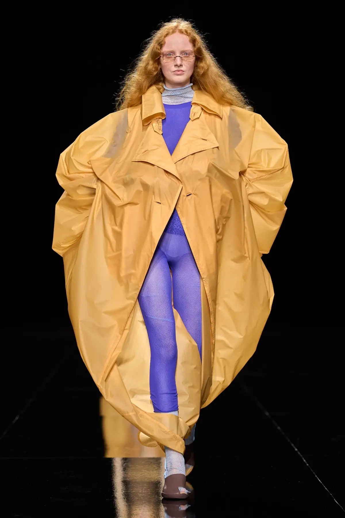 Look 50. A yellow coat standing away from the body.