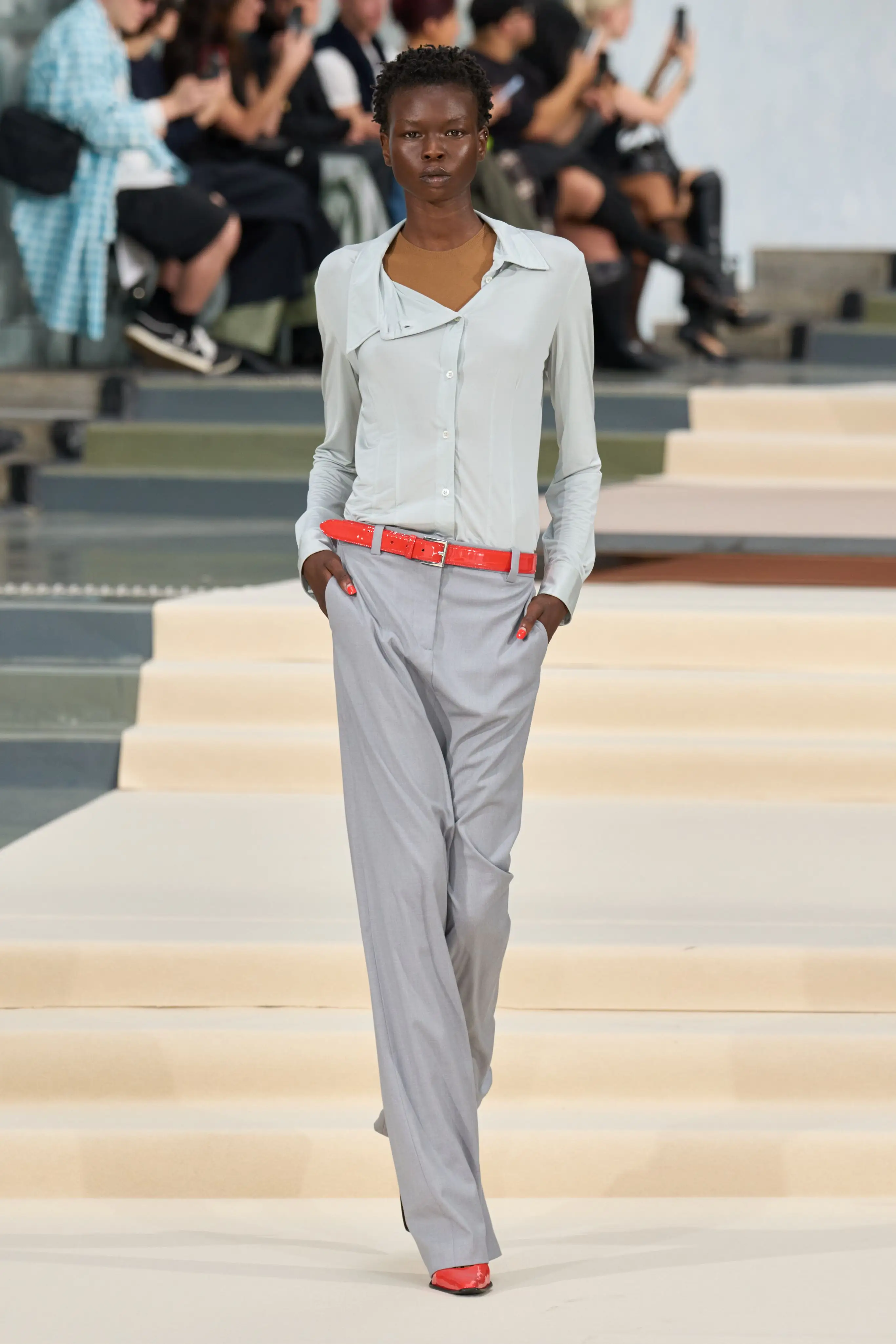 Look 1. Dropped crotch; the trousers sit far below the belt.