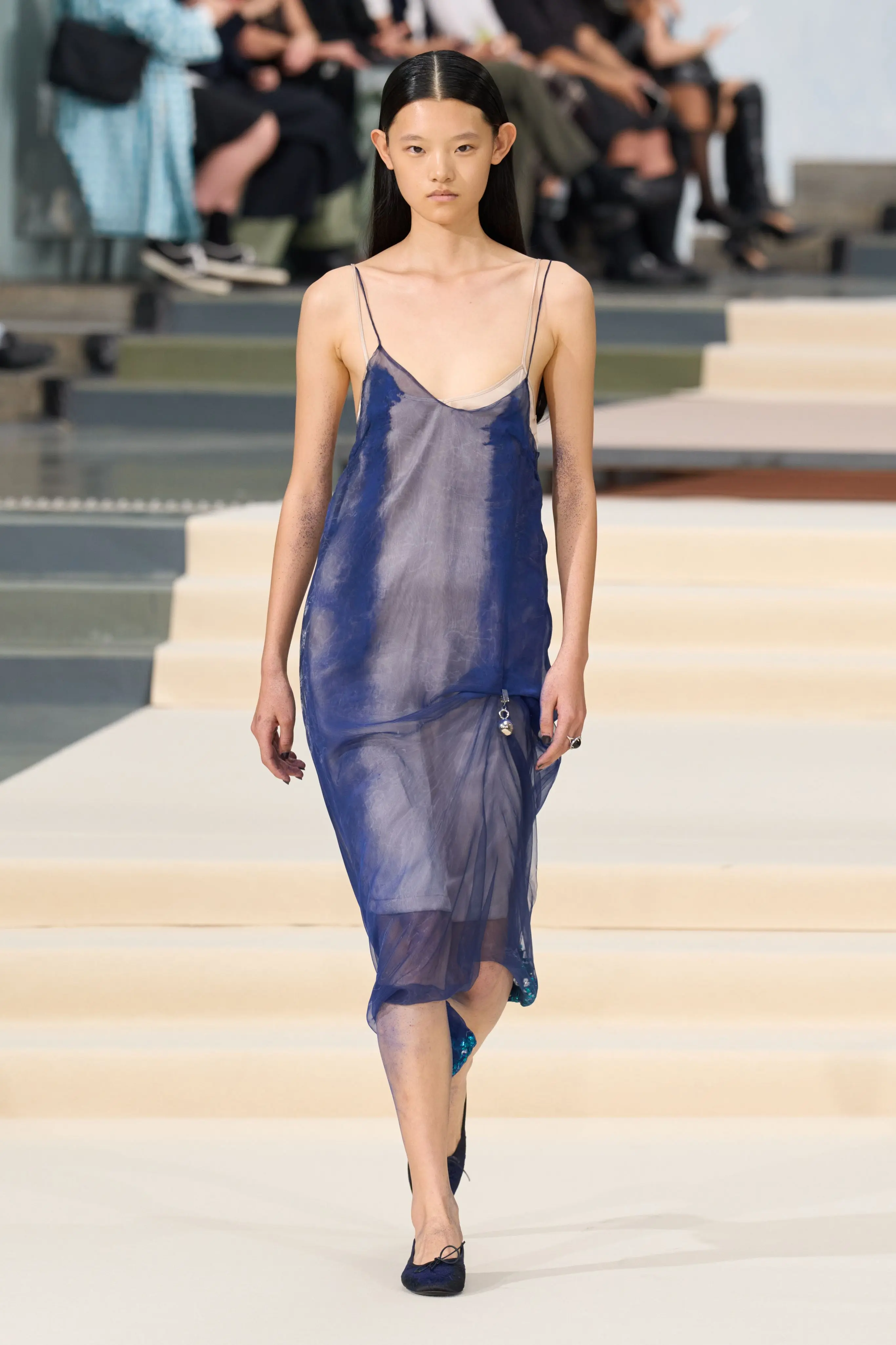 Julie Kegels SS27, Look 17. A sheer indigo and grey organza slip dress, full length.