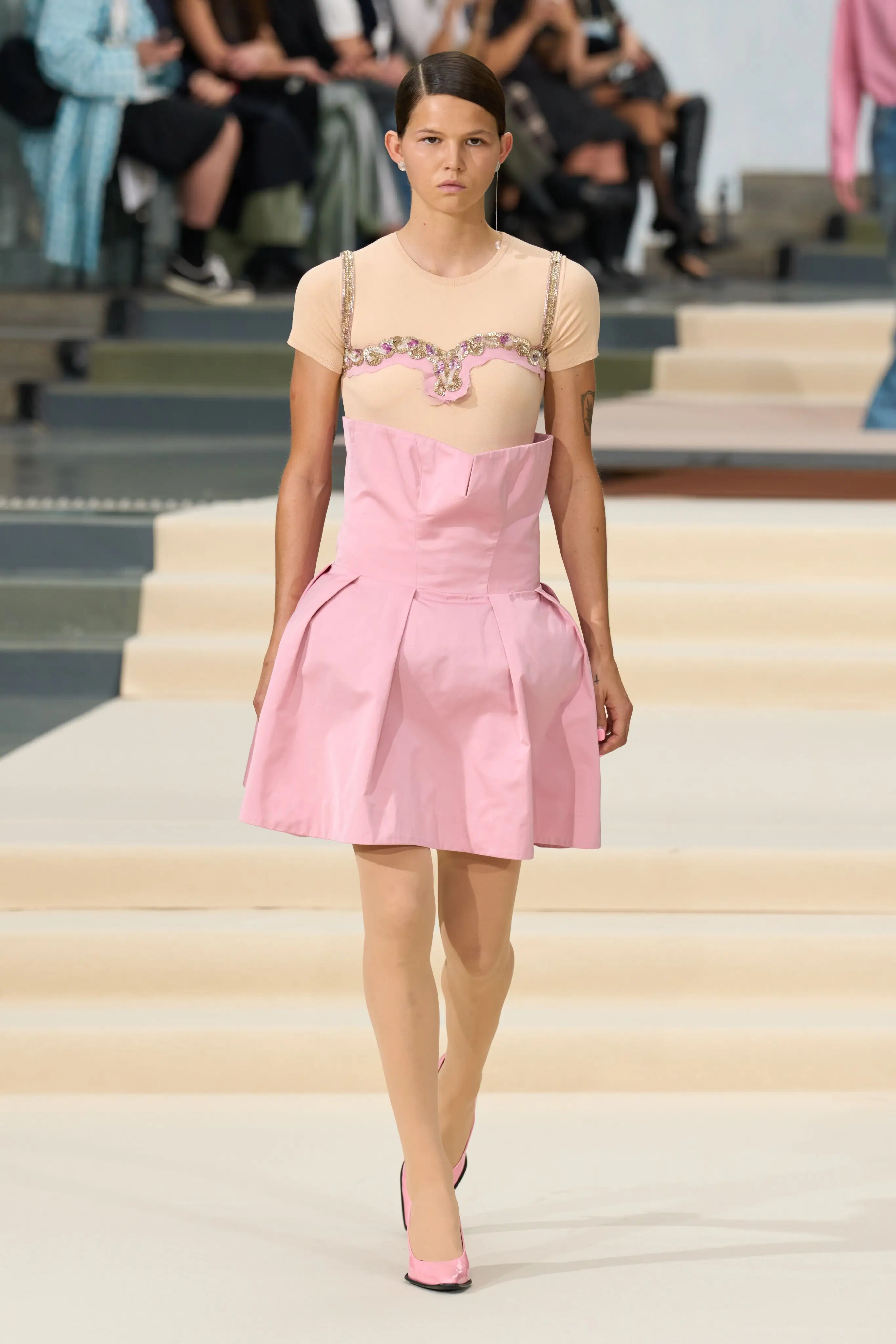 Look 34. Stiff pink waist rim standing away from the body.