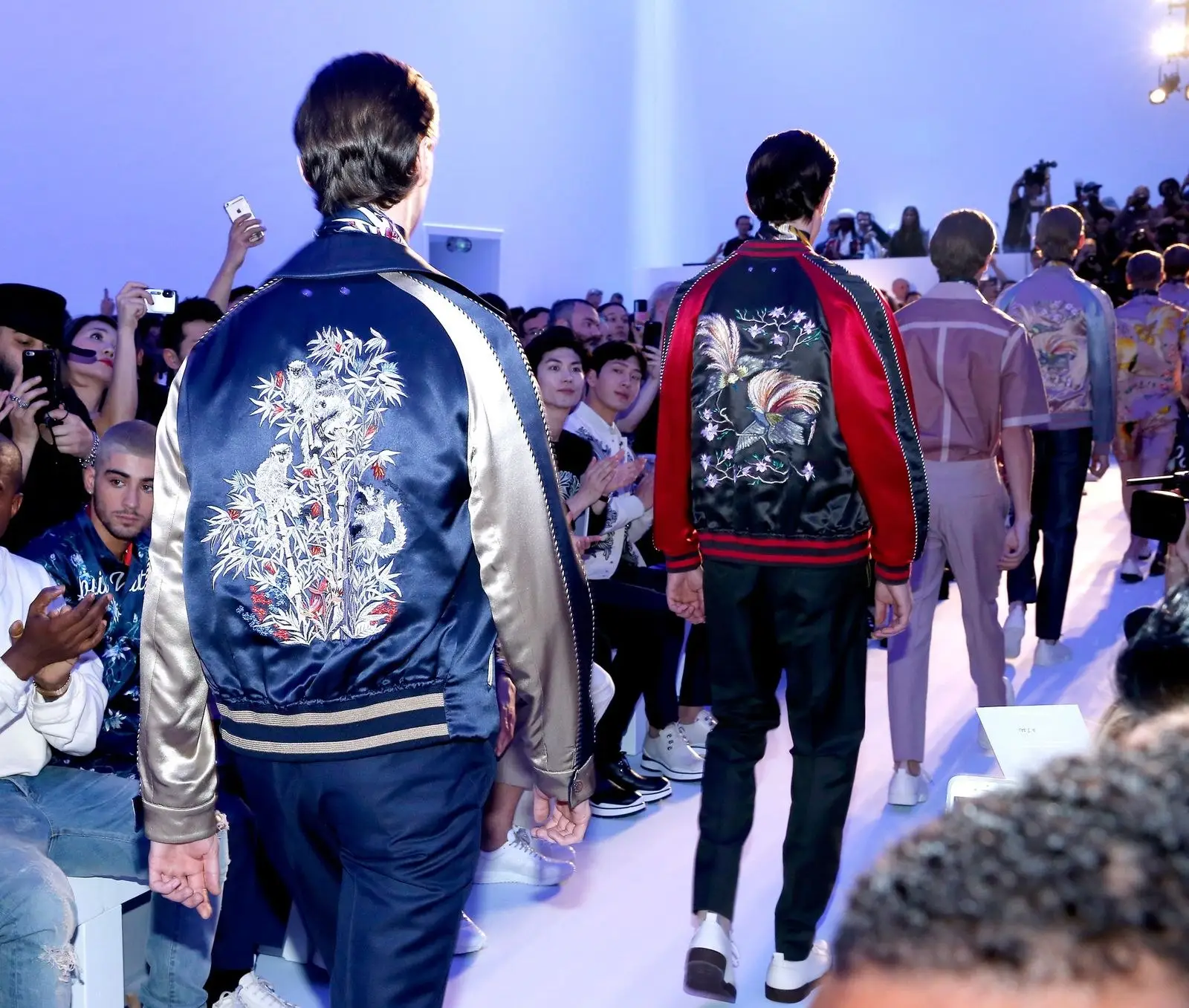 Louis Vuitton, Spring 2016 menswear, with Hiroshi Fujiwara. Souvenir jackets treated like tailoring: the reversible idea, at house scale.