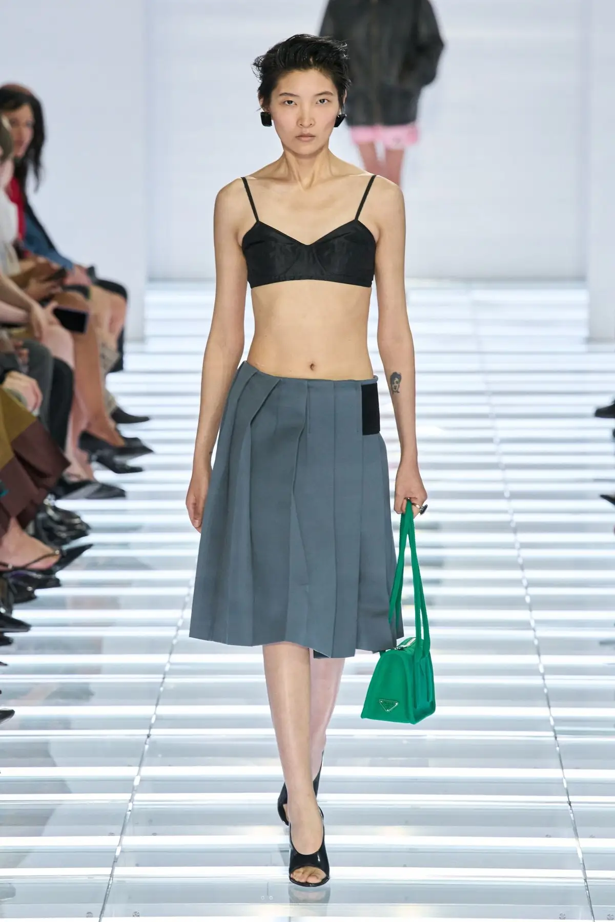 Look 4. Grey, knee length, with a bra top.