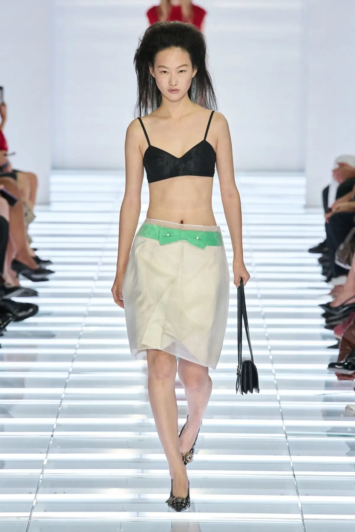 Look 21. A pale skirt with a bright waistband.