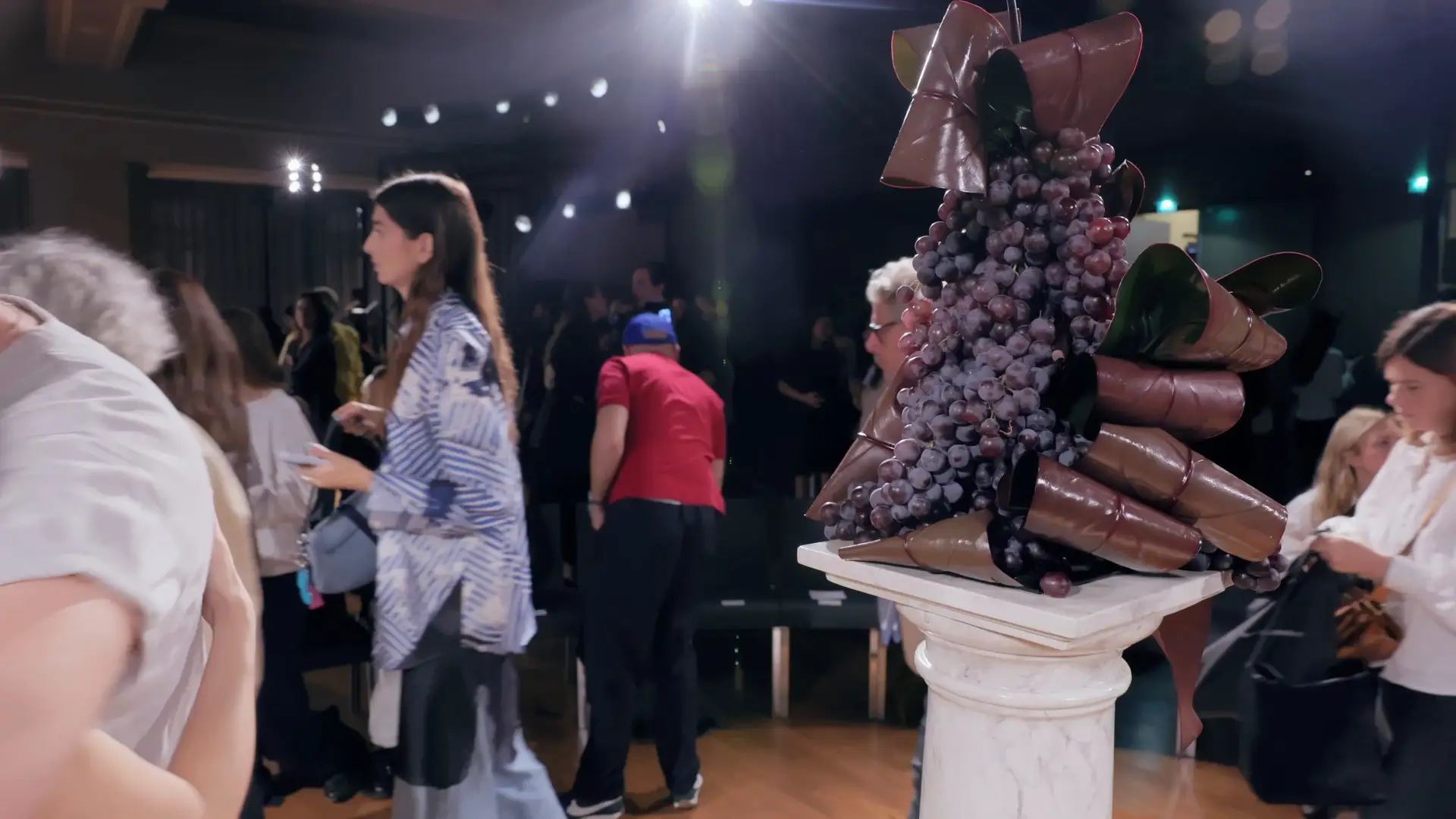 After the show: grapes and vegetables sculpted on a column.