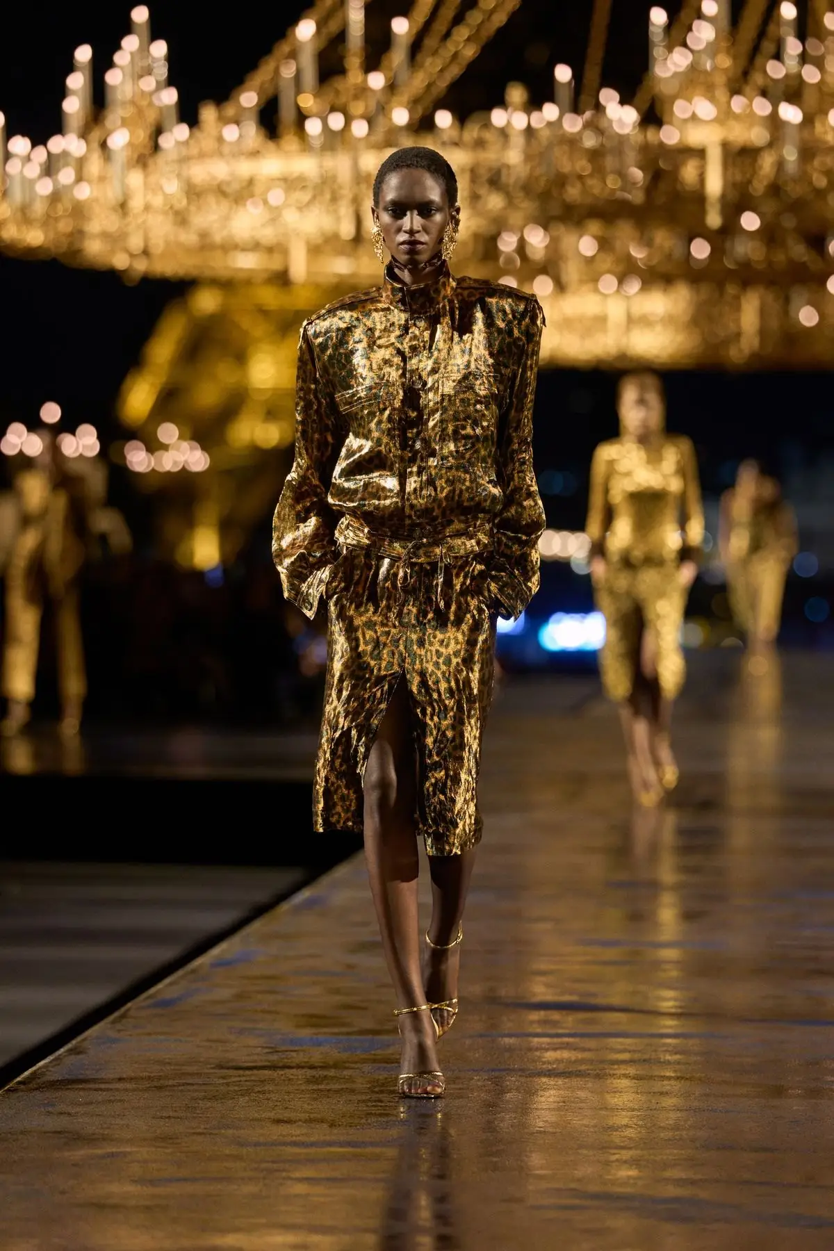 Look 30. A gold jacket and skirt.