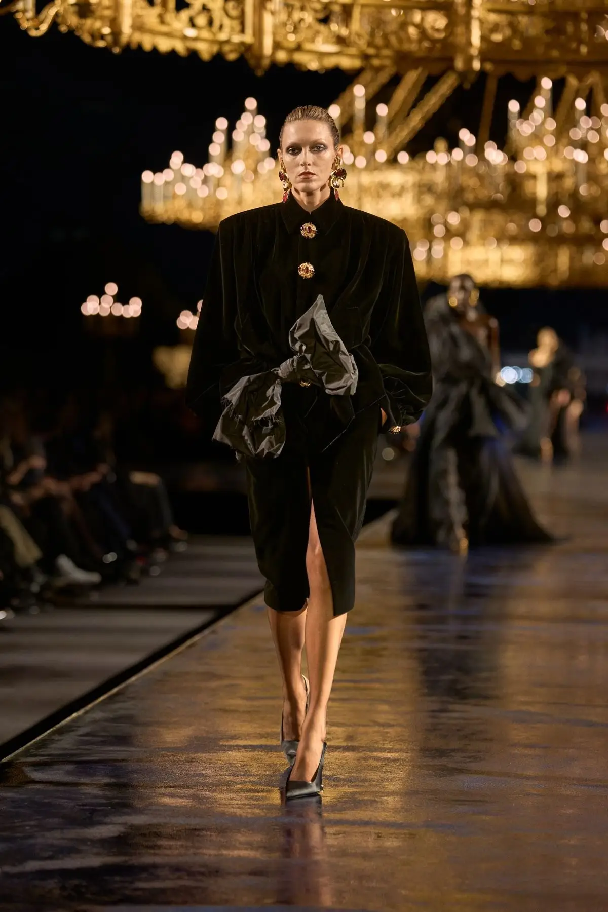 Look 50. The first black look. Watch the shoulders.