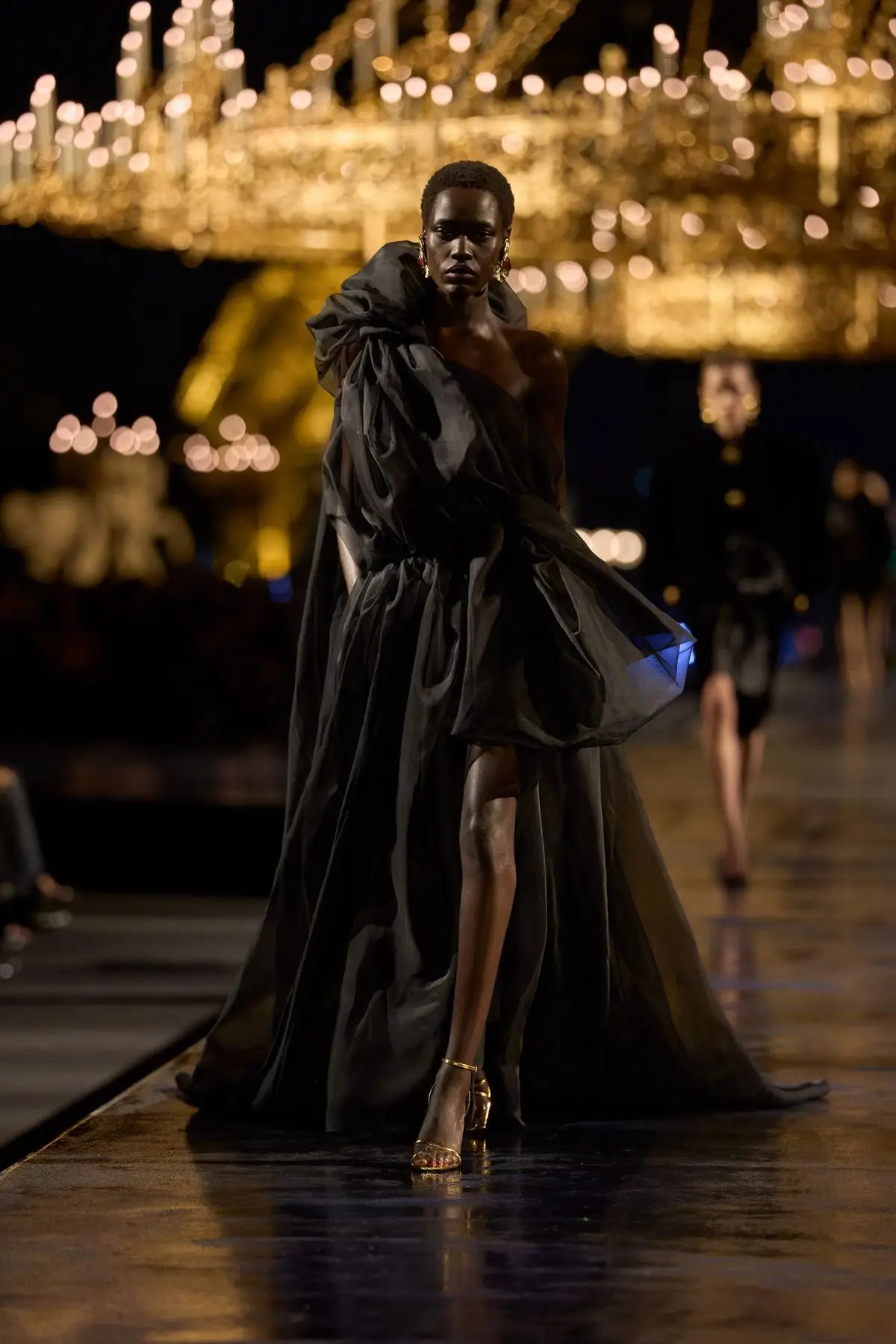 Look 51. Black, floor length, full volume.